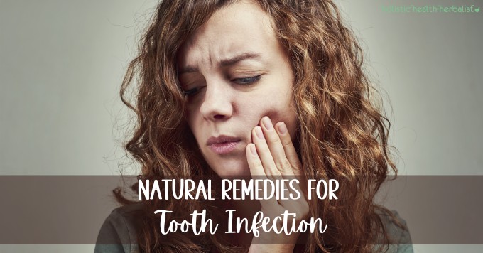 woman with a toothache - natural remedies for tooth infection